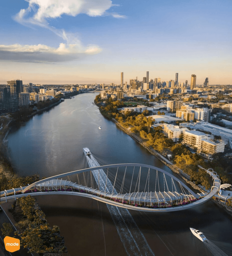 Pedestrian bridge covered in vines connecting two towers